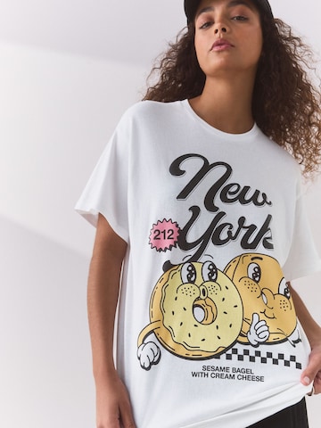Next Μπλουζάκι 'New York Bagel' σε λευκό