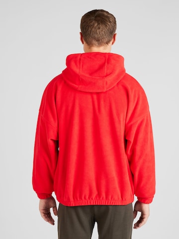 Sweat-shirt 'CLUB+ Polar' Nike Sportswear en rouge