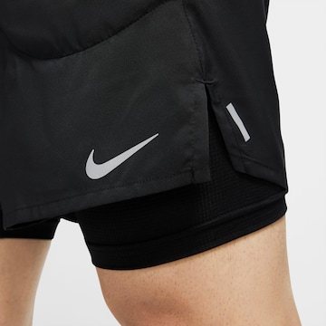 NIKE Regular Workout Pants 'Flex Stride' in Black