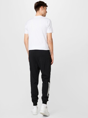 ELLESSE Tapered Sportbroek 'Materaza' in Zwart