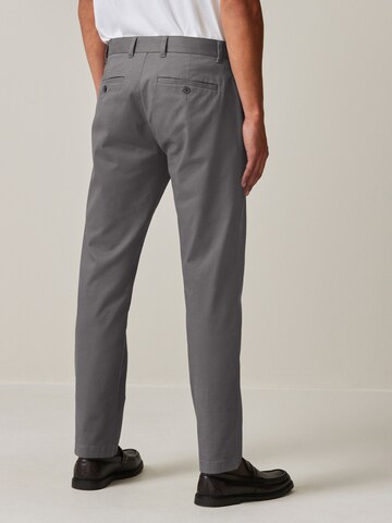 Slimfit Pantaloni chino di Next in grigio