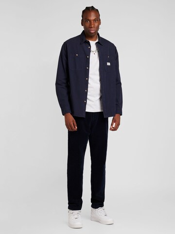 Tapered Pantaloni cutați 'HARLEM' de la TOMMY HILFIGER pe albastru