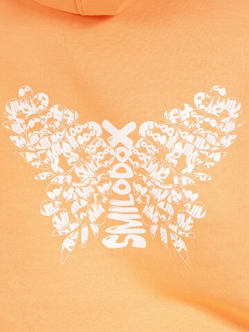 Veste de survêtement ' Nala ' Smilodox en orange