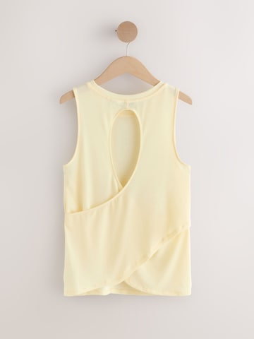Next - Top deportivo 'Active' en amarillo