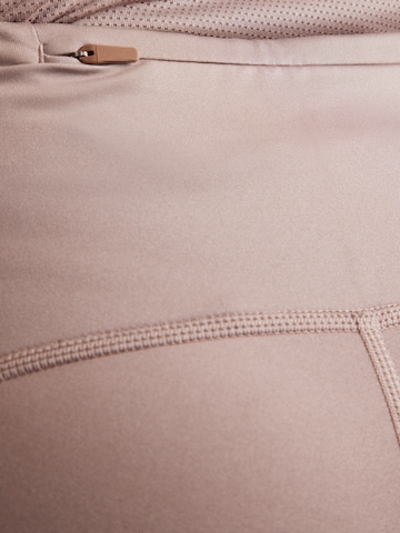 Skinny Pantalon de sport NIKE en marron