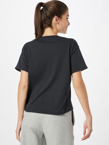 UNDER ARMOUR - Camiseta funcional 'Glow' en negro