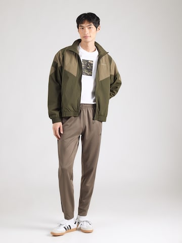 Tapered Pantaloni 'SST' de la ADIDAS ORIGINALS pe maro
