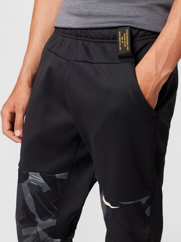 NIKE Tapered Sportbroek in Zwart