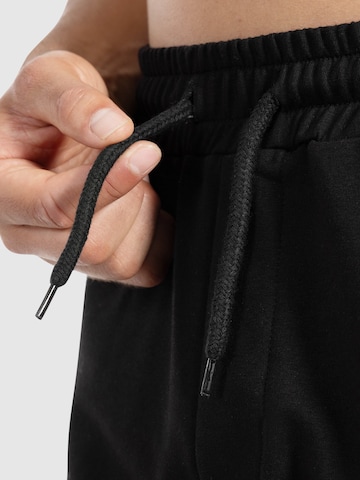 Loosefit Pantalon de sport ' Edin ' Smilodox en noir