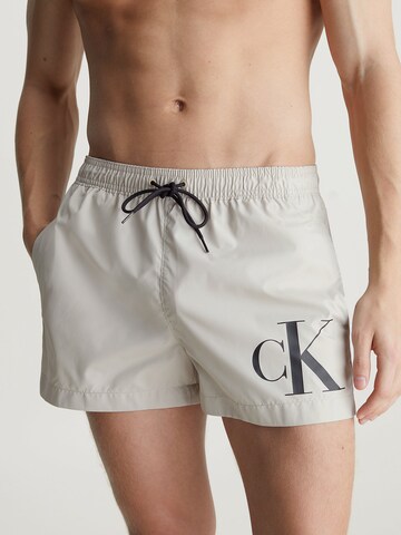 Calvin Klein Swimwear Board Shorts in Beige: front