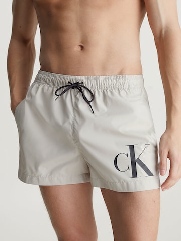 Calvin Klein Swimwear Board Shorts in Beige: front