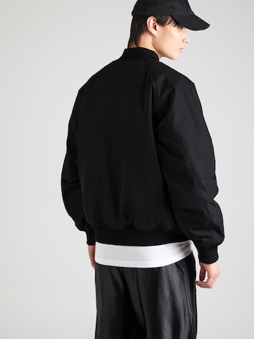 ADIDAS ORIGINALS Between-Season Jacket 'TEAMGEIST' in Black