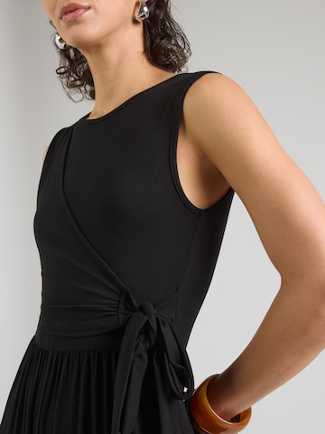 ABOUT YOU Kezeslábas 'Milly' - fekete