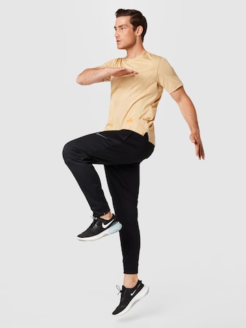 NIKE Functioneel shirt 'Rise' in Beige