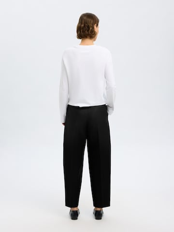 Loosefit Pantaloni con piega frontale di SELECTED in nero