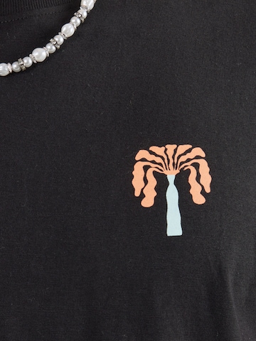 Maglietta 'PARADISE' di Kaotiko in nero