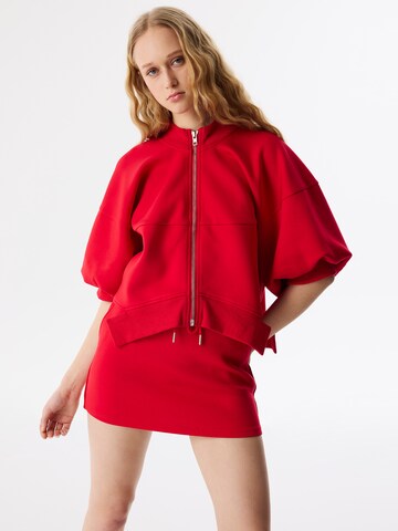 Veste de survêtement Twist en rouge : devant