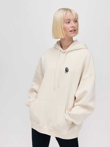 UNFOLLOWED x ABOUT YOU Sweatshirt 'STRONG' in Beige: front