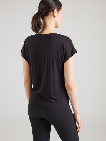 Maglia funzionale di CURARE Yogawear in nero