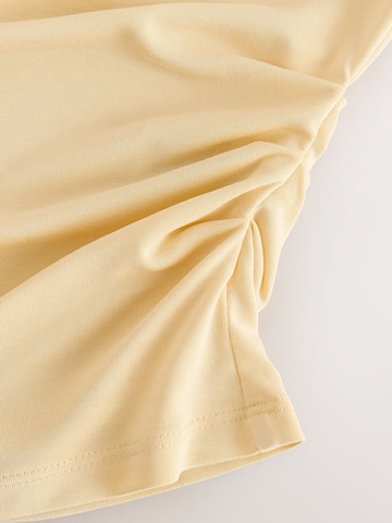 Haut Next en jaune
