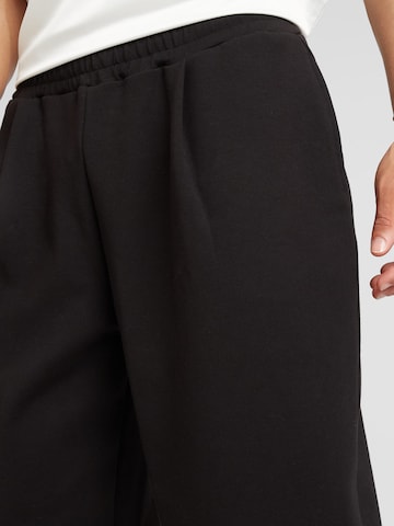 TOPMAN Zvonové kalhoty Kalhoty se sklady v pase – černá