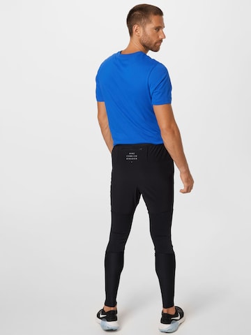 NIKE - Skinny Pantalón deportivo 'Phenom Run Division' en negro