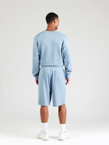 Loosefit Pantalon de sport 'Rival' UNDER ARMOUR en bleu