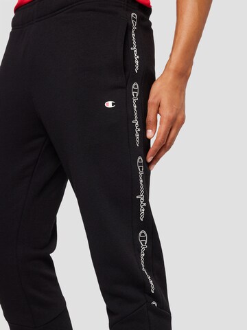 Tapered Pantaloni di Champion Authentic Athletic Apparel in nero