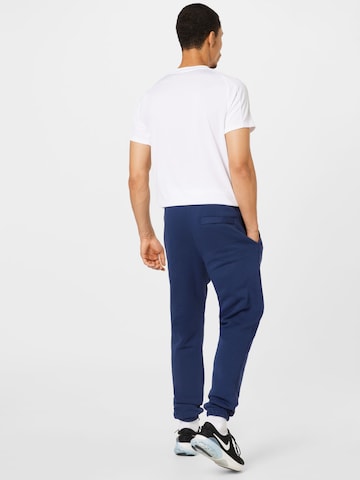 Nike Sportswear Zwężany krój Spodnie 'Club Fleece' w kolorze niebieski
