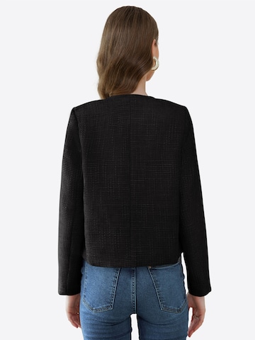 Imily Bela Tussenjas in Zwart: terug