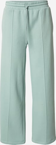 Pantaloni de la CONVERSE pe verde: față