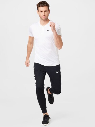 T-Shirt fonctionnel NIKE en blanc