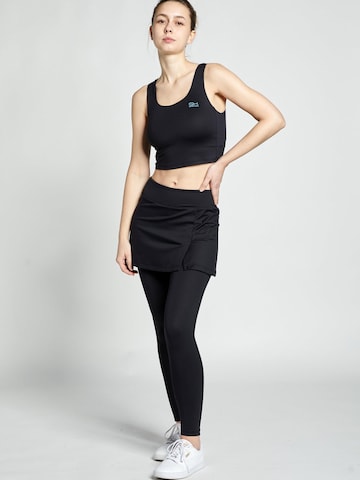 SPORTKIND - regular Pantalón deportivo '2-in-1 Skirt' en negro: frente