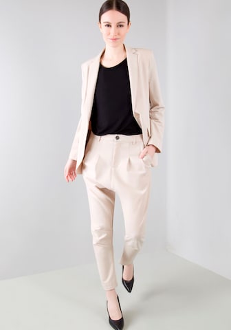 IMPERIAL Tapered Pleat-Front Pants in Beige