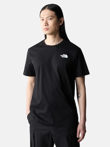 T-Shirt 'REDBOX CELEBRATION ' THE NORTH FACE en noir : devant