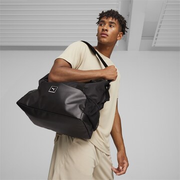 PUMA Sports Bag in Black: front