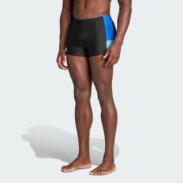 ADIDAS PERFORMANCE Athletic Swim Trunks in Black: front