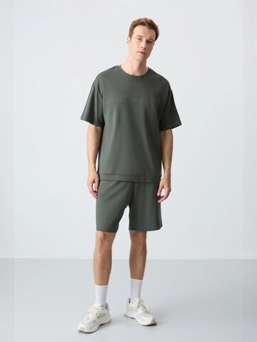 Tommy Life Tracksuit in Green: front