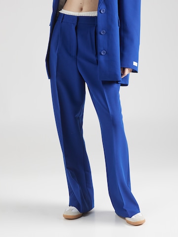 Karo Kauer - Perna larga Calças com vincos em azul: frente