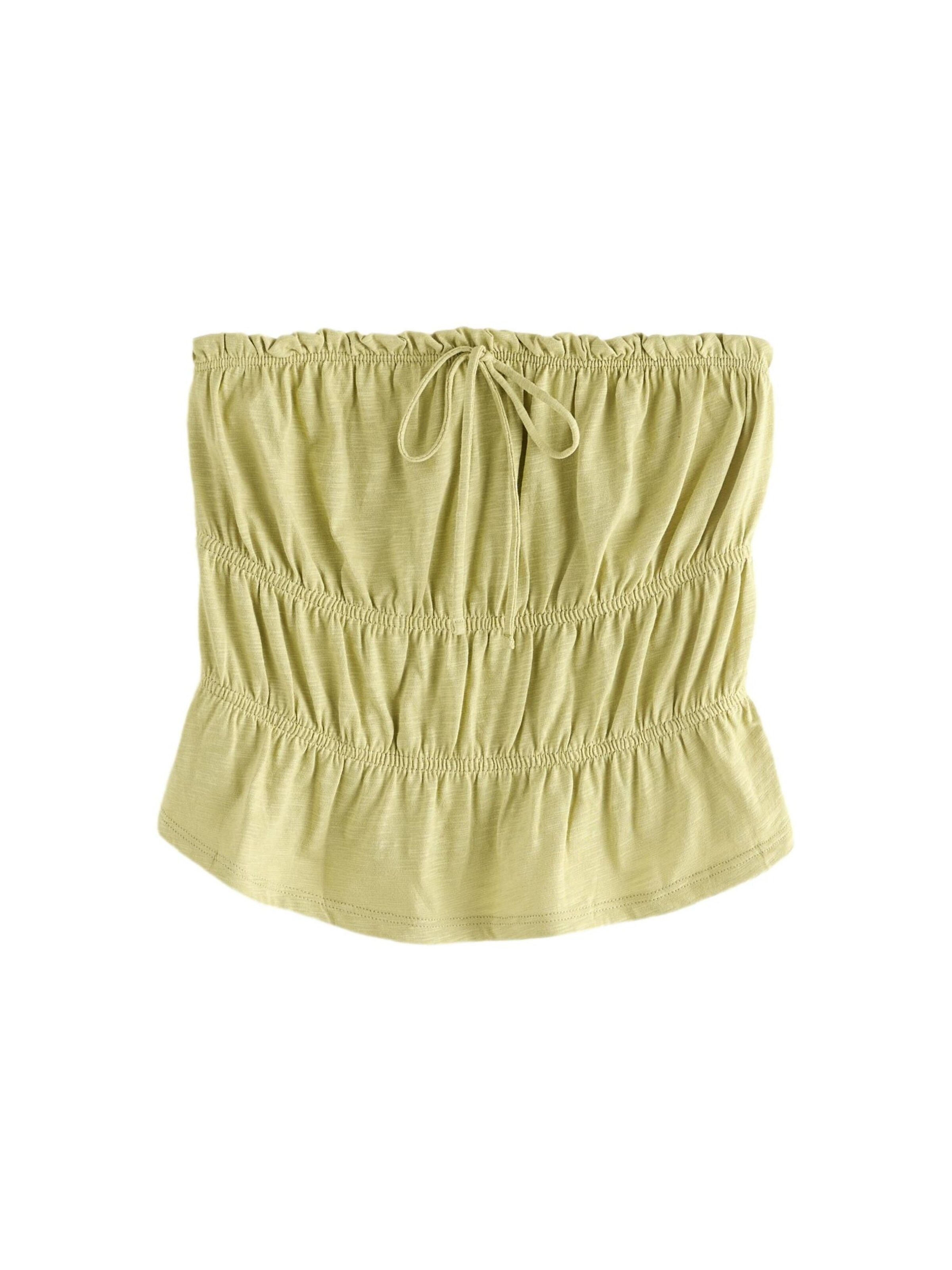 Haut Next en vert : devant