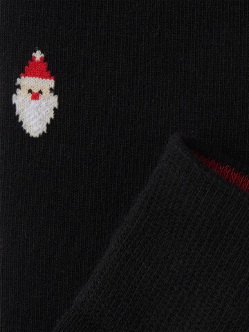 Von Jungfeld Socken 'mit Weihnachtsmotiven' in Schwarz