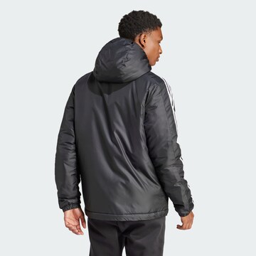 ADIDAS SPORTSWEAR Куртка в спортивном стиле 'Essentials' в Черный