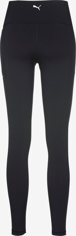 PUMA Skinny Sports trousers in Black