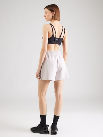 Loosefit Pantaloni di Nike Sportswear in lilla