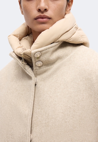 RINO & PELLE Pitkä talvitakki 'Omri' värissä beige