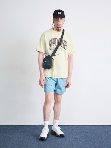 Nike SportswearLoosefit Hlače 'Club' - plava boja