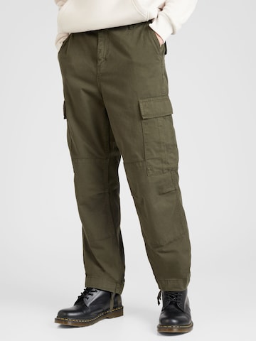 Carhartt WIP Широка кройка Карго панталон в зелено: отпред