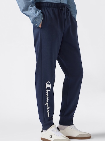 Champion Authentic Athletic Apparel Zwężany krój Spodnie w kolorze niebieski: przód