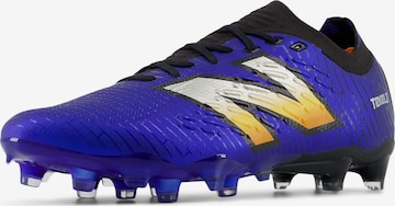 Chaussure de foot 'TEKELA PRO V4+' new balance en violet : devant
