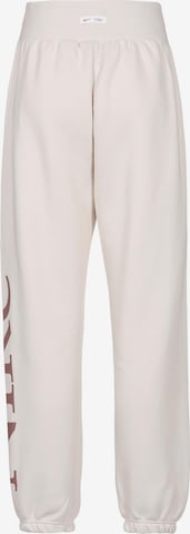 Effilé Pantalon 'Phoenix' Nike Sportswear en beige
